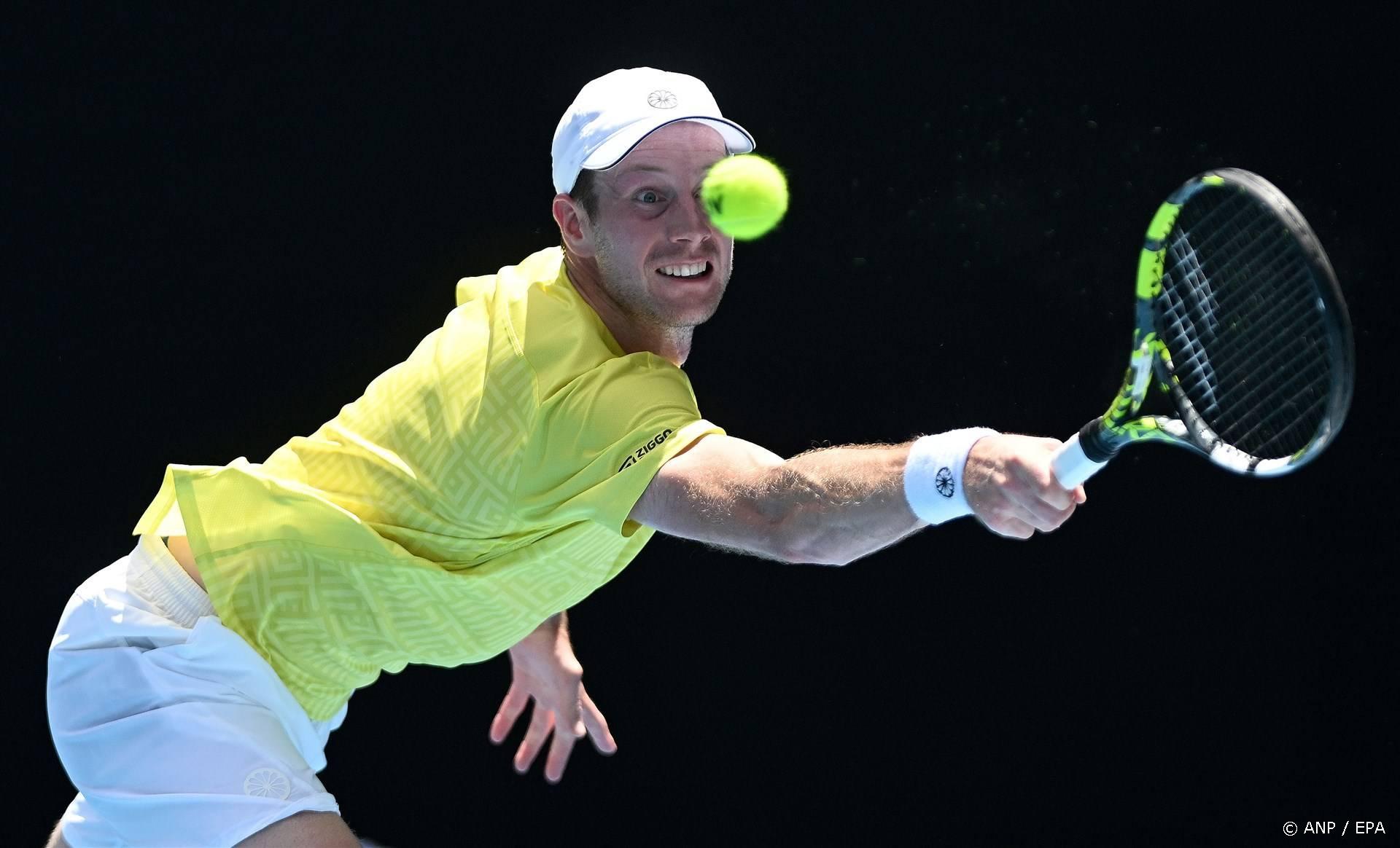 epa11075097 Botic van de Zandschulp of Netherlands returns during his first round match against Jannik Sinner of Italy on Day 1 of the 2024 Australian Open at Melbourne Park in Melbourne, Australia, 14 January 2024.  EPA/LUKAS COCH AUSTRALIA AND NEW ZEALAND OUT