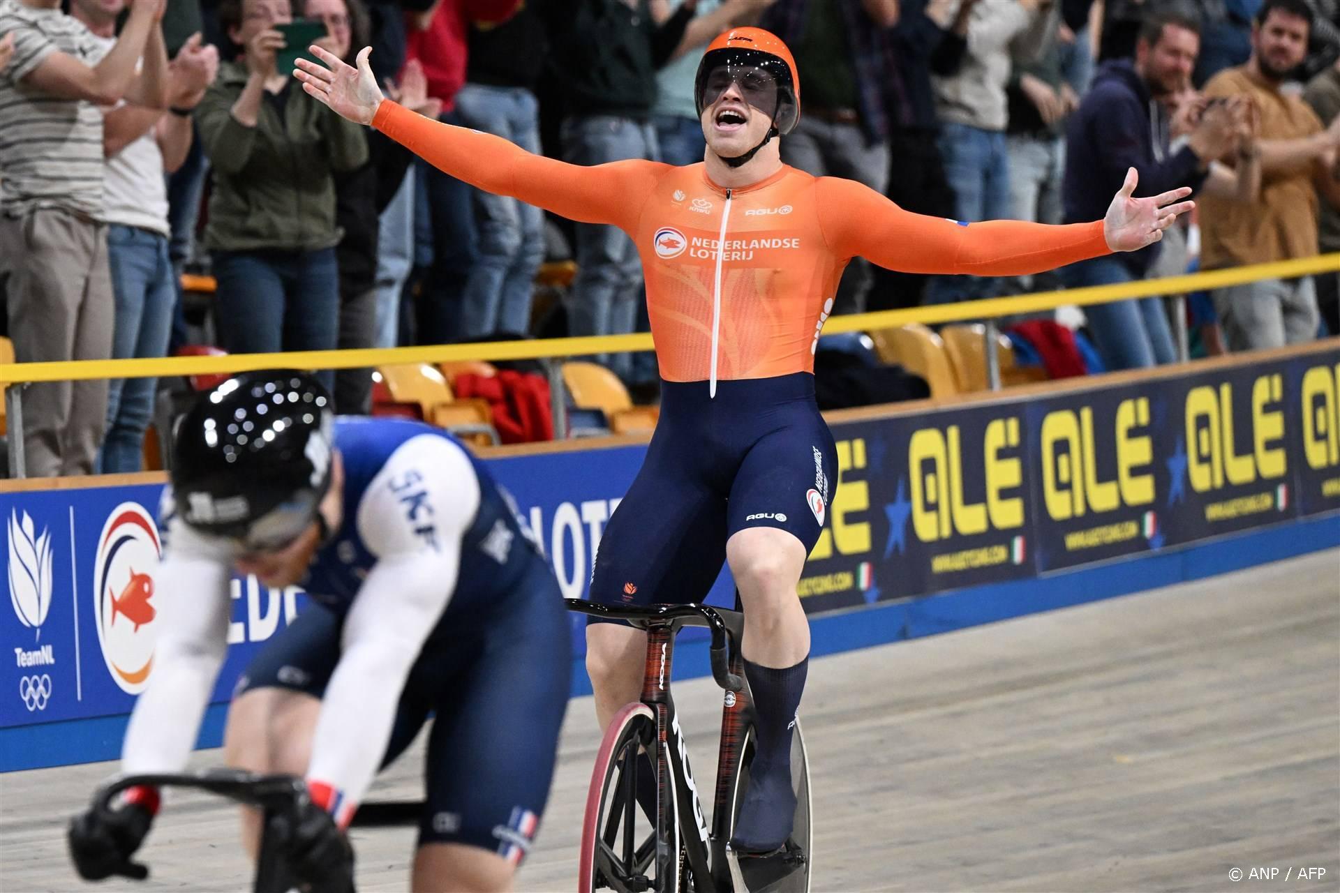 First placed Netherlands' Harrie Lavreysen (C) celebrates winning gold in the final round of the Men's Keirin race during the fifth day of the UEC European Track Cycling Championships at the Omnisport indoor arena in Apeldoorn, on January 14, 2024. 
JOHN THYS / AFP