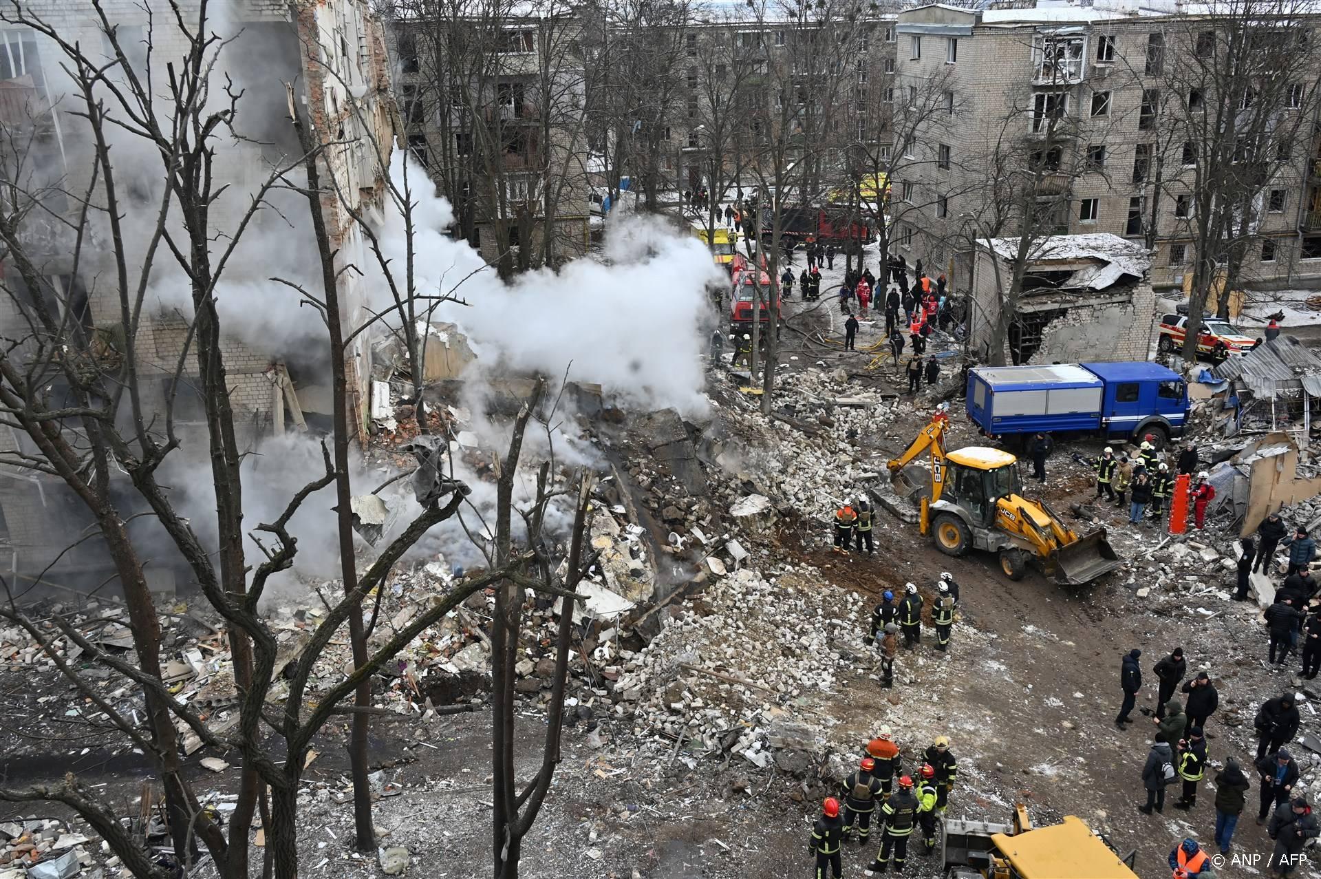 Ukrainian rescue workers clear debris at the site of a missile attack in Kharkiv on January 23, 2024, amid the Russian invasion of the Ukraine. Six people were killed and dozens wounded after a wave of Russian missiles targeted Kyiv and other cities across Ukraine, setting residential buildings ablaze and reducing others to rubble.
SERGEY BOBOK / AFP