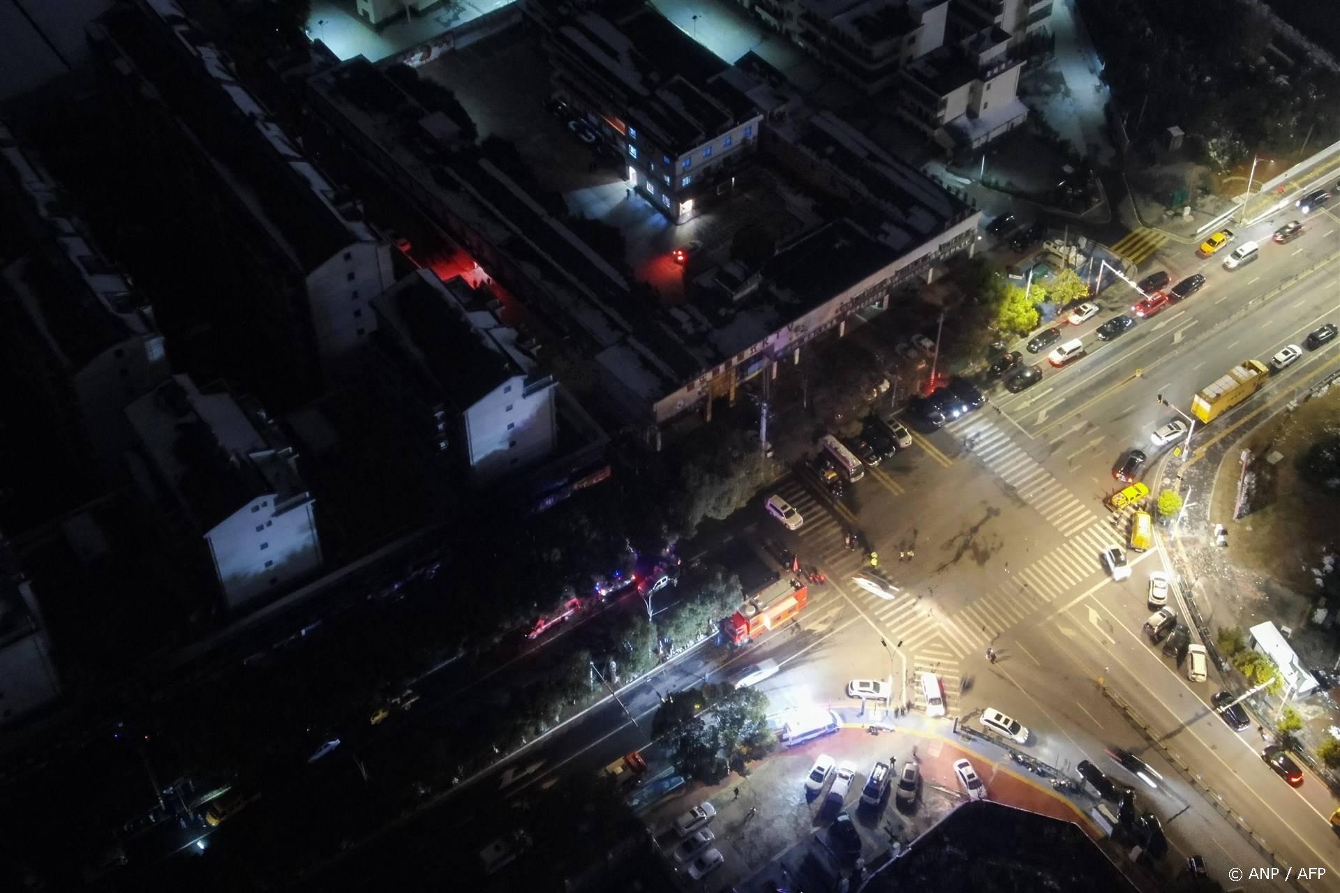 This photo taken on January 24, 2024 shows fire trucks and emergency vehicles at the scene of a fire that broke out at a store leaving at least 39 people dead in Xinyu, in China’s central Jiangxi province. 
CNS / AFP