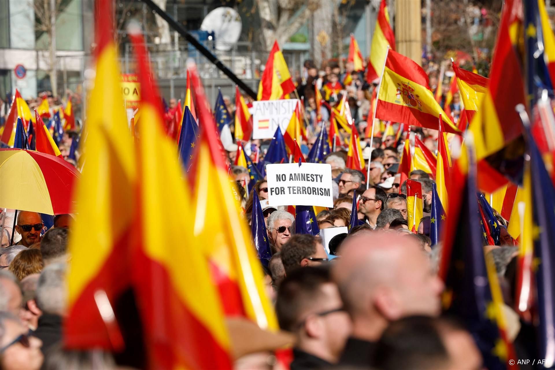 Protestors hold signs during a demonstration called by the opposition party Partido Popular (PP) against the government's amnesty law for people involved in Catalonia's failed 2017 independence bid, and 