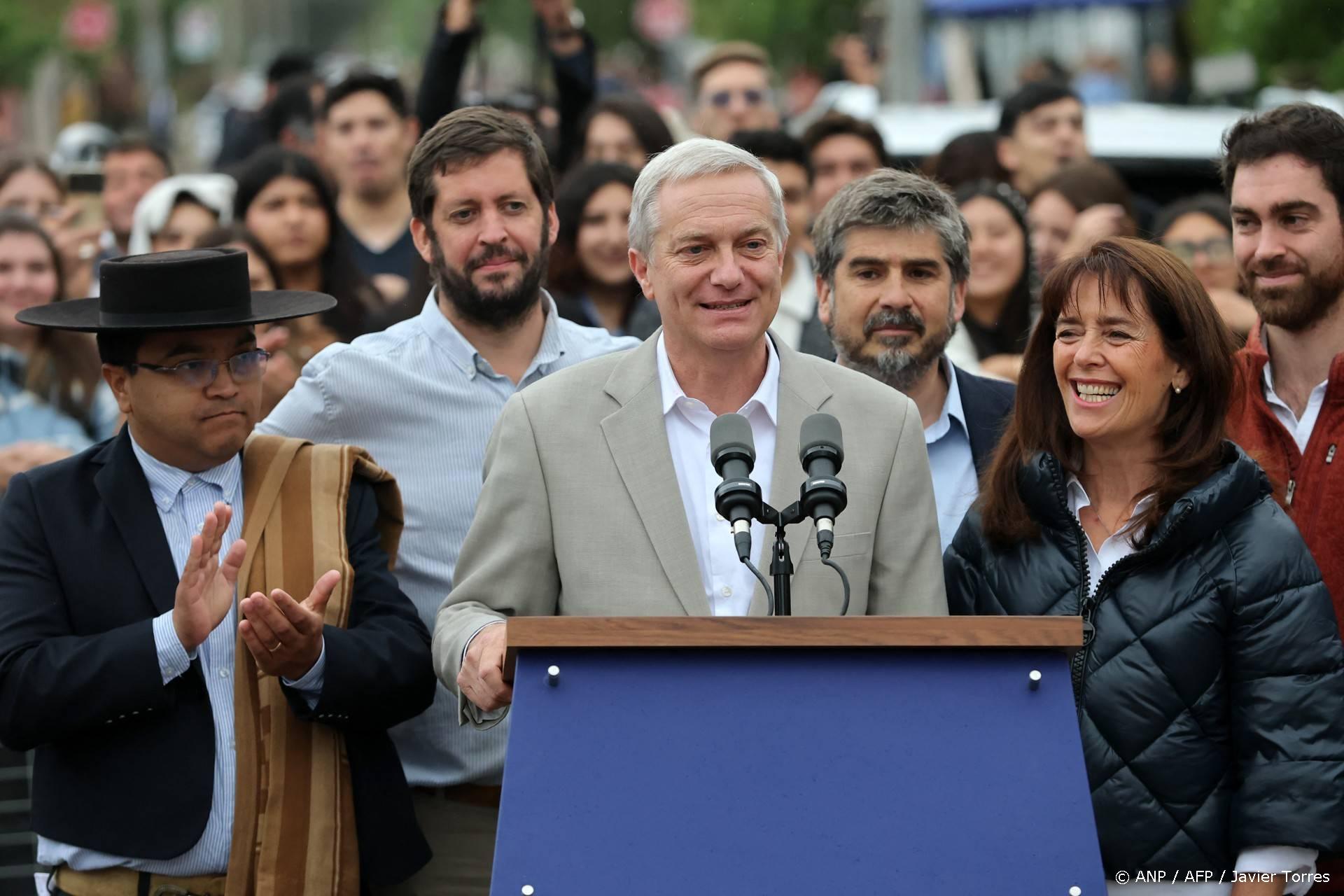 Chile's presidential candidate Jose Antonio Kast, of the Partido Republicano party, speaks next to his wife Maria Pia Adriasola (R) outside a polling station after casting his ballot during the presidential runoff election in Paine, south of Santiago, on December 14, 2025. Chileans head to the polls for a presidential runoff between Jeannette Jara, a communist backed by a broad left coalition, and Jose Antonio Kast, a devout far-right politico promising a hard line on security and migration.
Javier TORRES / AFP