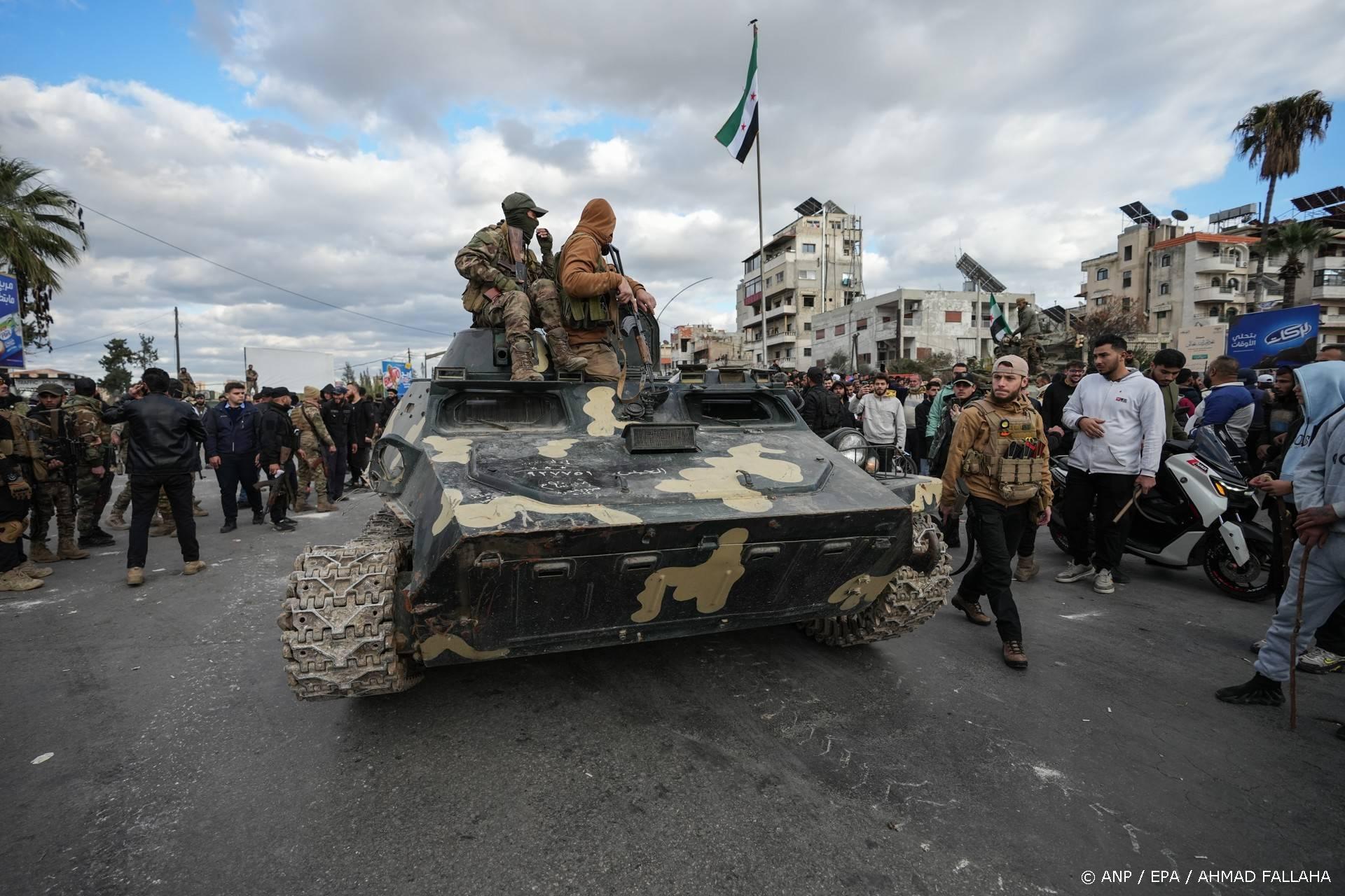 epa12615658 Syrian Security forces stand atop a military vehicle as forces are deployed after clashes erupted during a protest by members of the Alawite community in the city of Latakia, Syria, 28 December 2025. The protesters gathered against attacks targeting the Alawite community after a bombing at the Imam Ali bin Abi Talib Mosque in an Alawite neighborhood of Homs province on 26 December, in which at least eight people were killed and more than a dozen injured. EPA/AHMAD FALLAHA