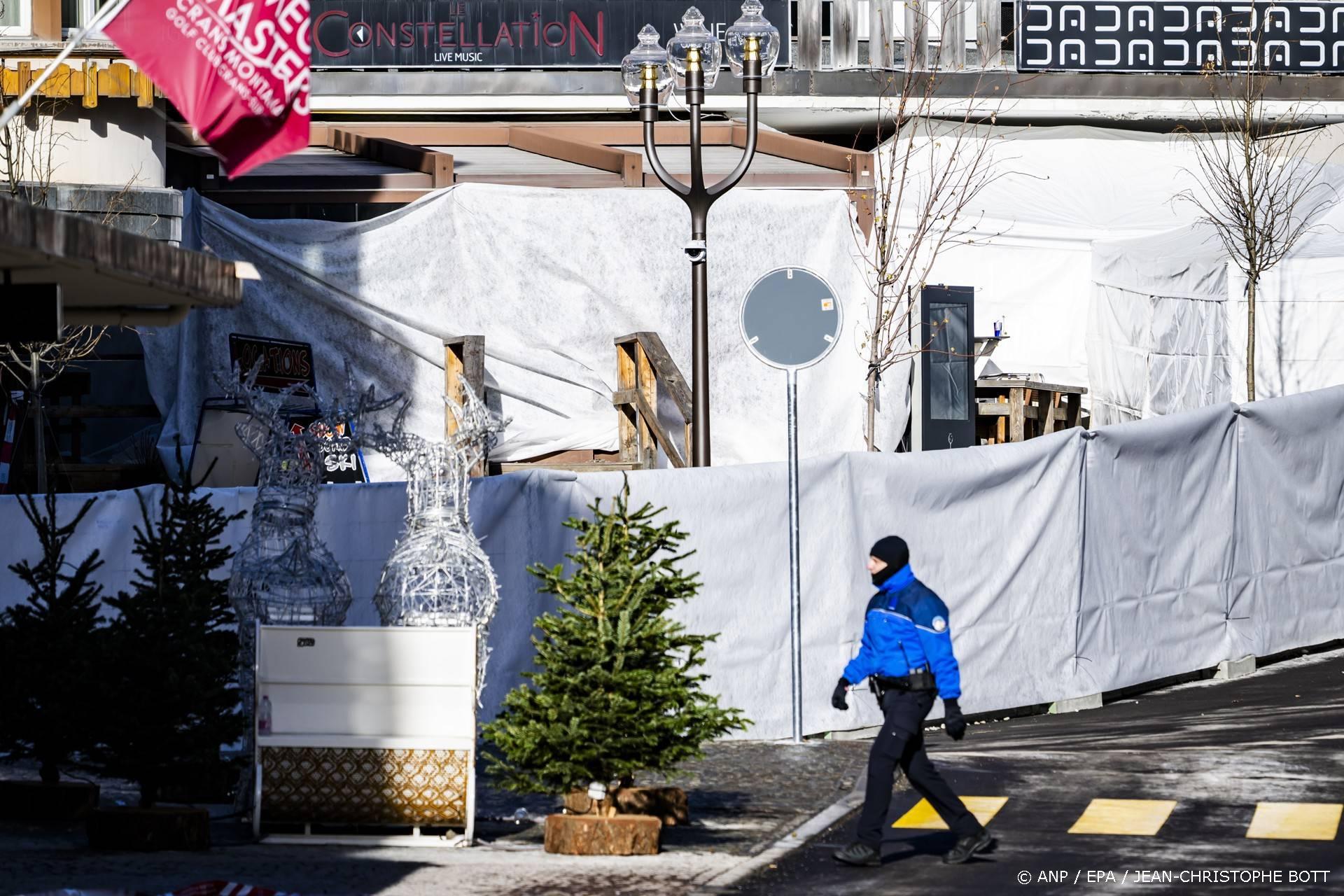 epa12620447 Police officers inspect the area where a fire broke out at the Le Constellation bar and lounge following an explosion in the early hours of New Year's Eve, in Crans-Montana, Switzerland, 01 January 2026. According to the police, several dozen people lost their lives in the fire and around one hundred people were also reported injured.  EPA/JEAN-CHRISTOPHE BOTT