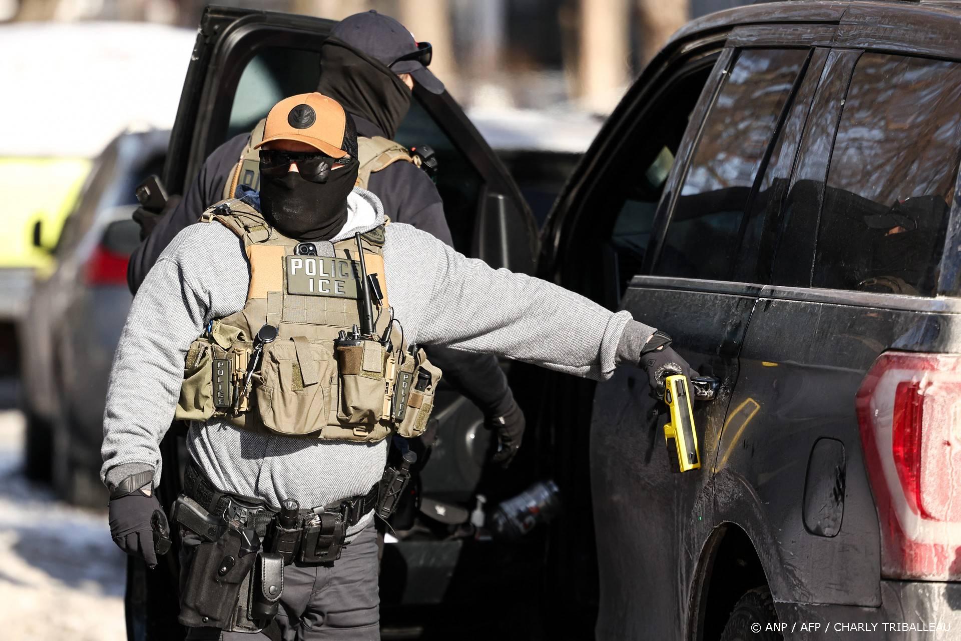 Federal agents stand by a vehicle after they detained a protester in Minneapolis, Minnesota on February 3, 2026. A US judge on January 31, 2026 denied Minnesota's bid to force Immigration and Customs Enforcement (ICE) to suspend its sweeping detention and deportation operation in the state that has left two US citizens dead and fueled massive protests. Masked and heavily armed federal agents have swept through Minnesota communities seeking undocumented migrants, detaining thousands and shooting dead two US citizens in the process.

Charly TRIBALLEAU / AFP